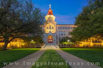 The Main Building on the campus of St. Edward's University rests in the pre-dawn light on a cool spring morning.