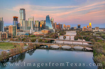 This aerial view shows Lady Bird Lake with the Austin skyline in the distance.