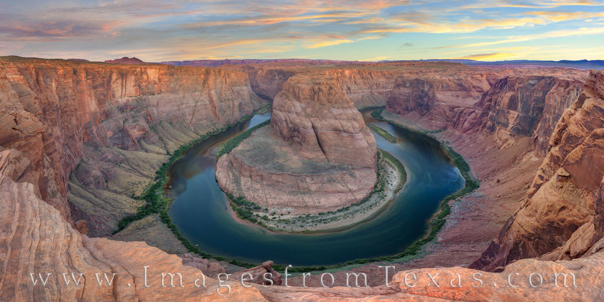 Horseshoe Bend is located just south of Page, Arizona. The rocky cliffs rise 1000 feet above the Colorado River far below.  From...