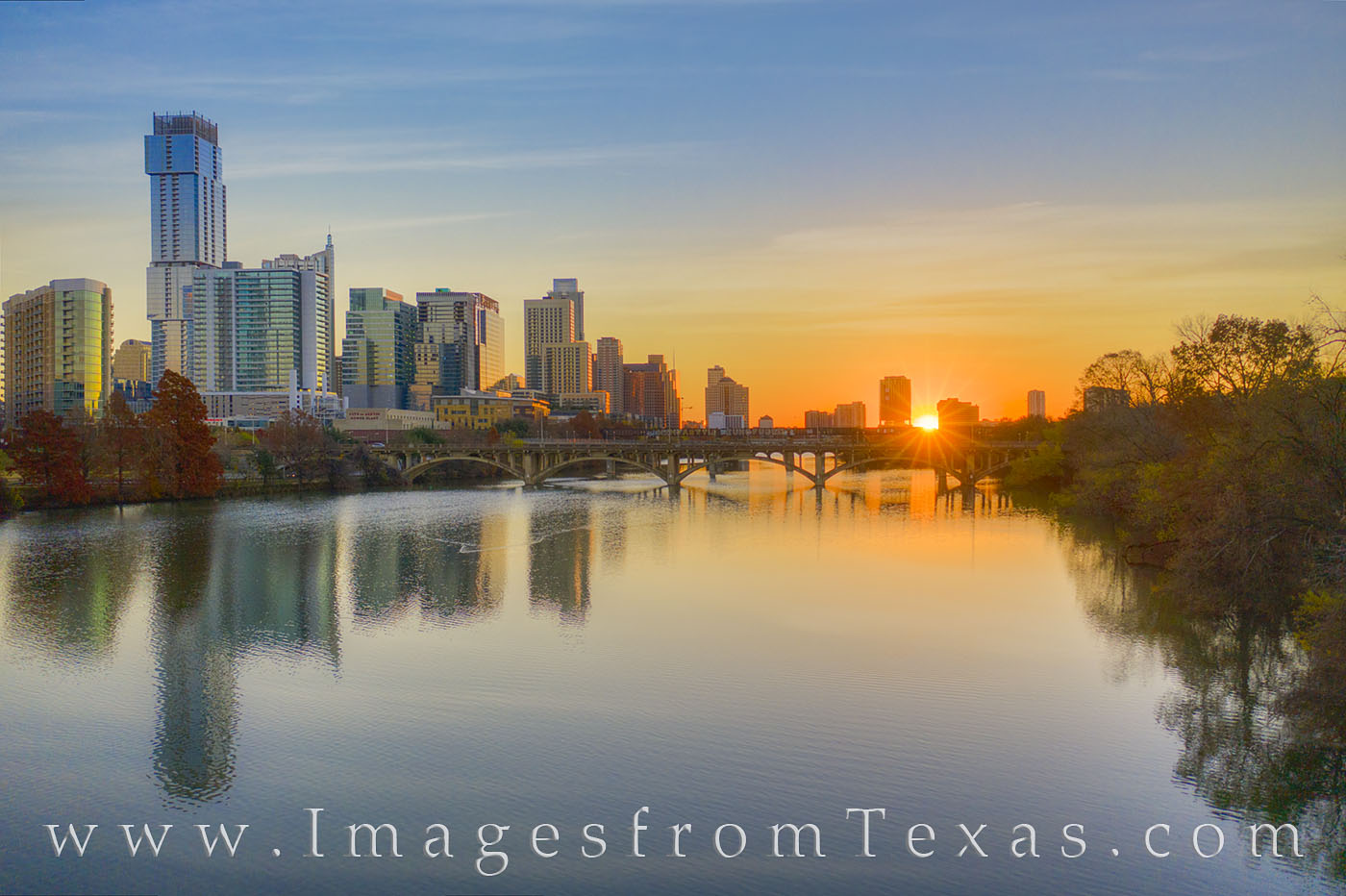 On a cold December morning, the waters of Ladybird Lake are calm. As the highrises of downtown Austin, Texas, shine in the first...