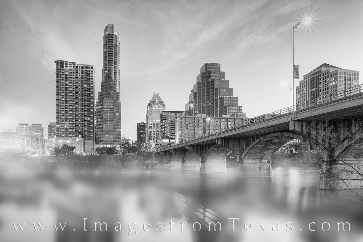 Surrounded by scrub, I wiggled my way through the brush and captured a few images of fog coming off Lady Bird Lake with the downtown...