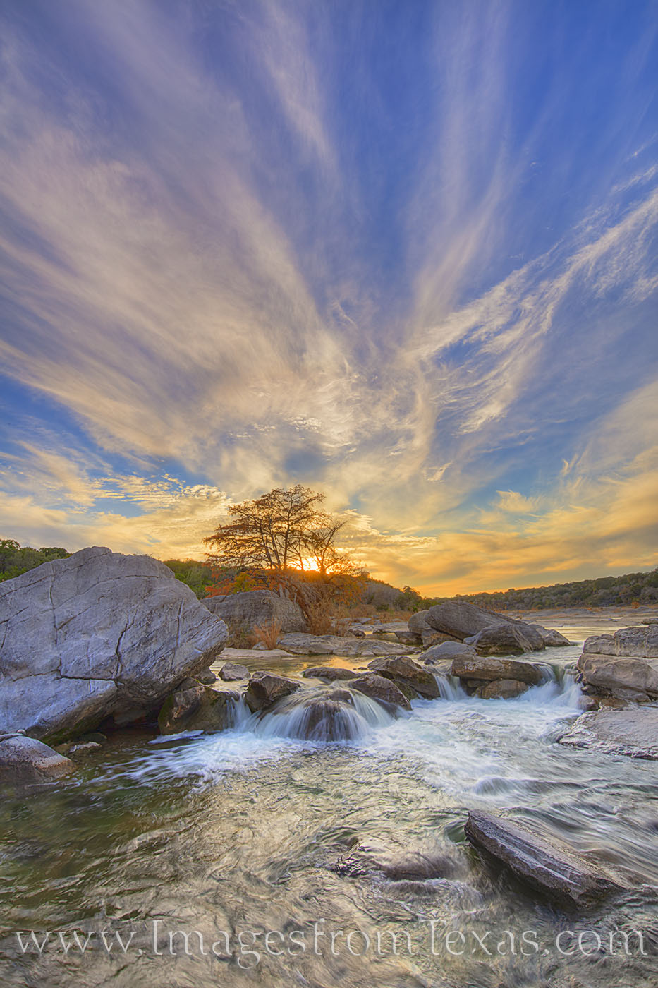 High clouds stretch out above the horizon on a cold evening in Pedeernales Falls State Park. The water was cool and clear, and...