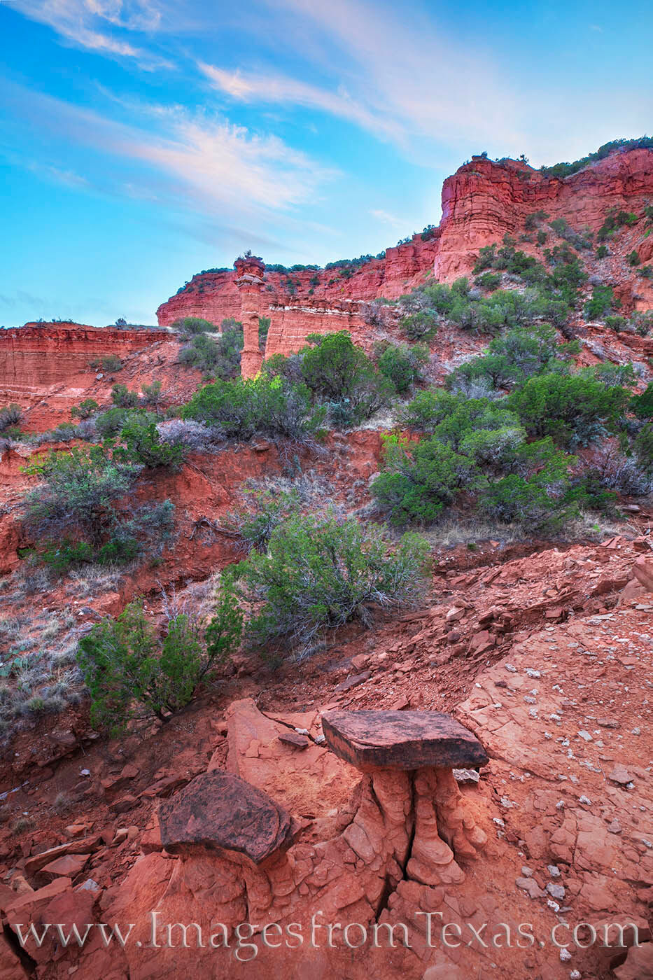 In the foreground, a small hoodoo sits unchanged, just as it has for a thousand years. Deep in the hidden valleys of Caprock...