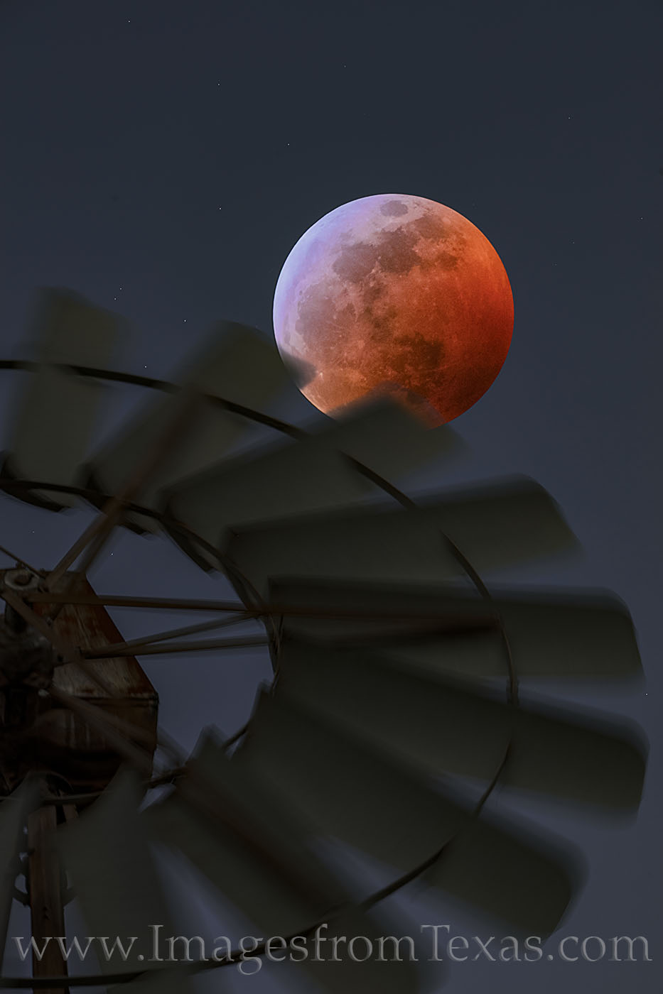 This blood moon image was taken at the peak of the eclipse. I used a windmill’s blades as the foreground – shot while basically...