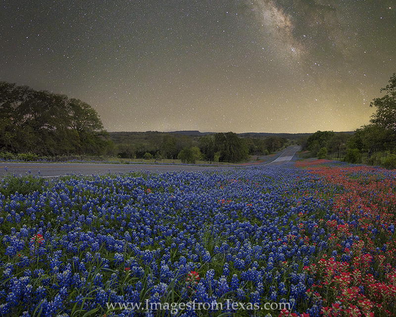 This photograph of the Milky Way over bluebonnets and paintbrush is the horizontal version of the original images - a vertically...