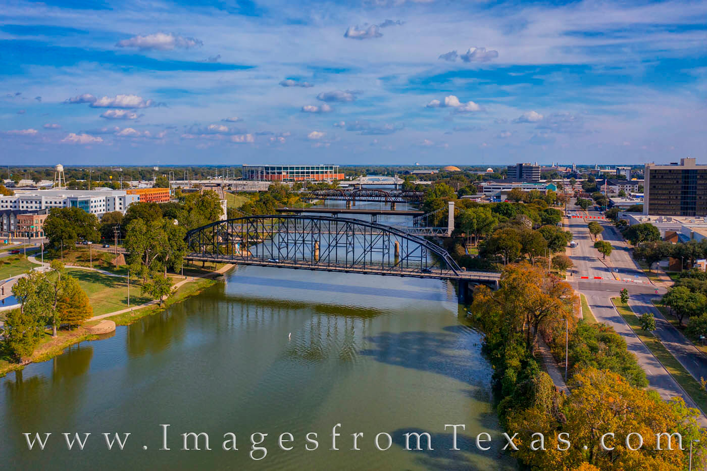 The Brazos River flows north of downtown Waco. Several old bridges connect the Riverwalk, including the Washington Avenue Bridge...