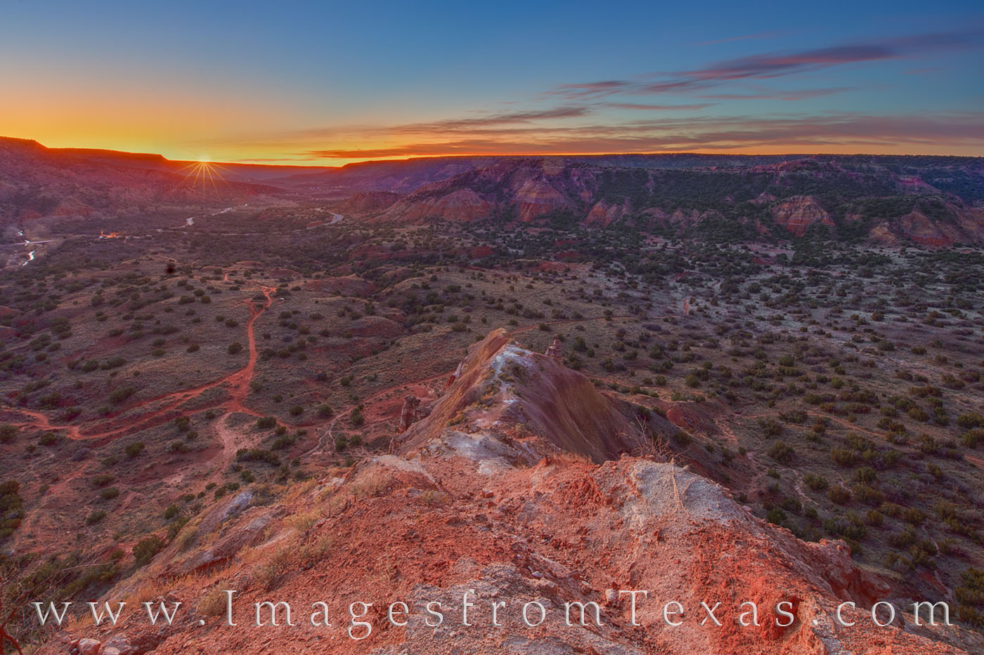 The first rays of daylight stream across Palo Duro Canyon on a cold November morning. Seen here from the top of Capitol Peak...