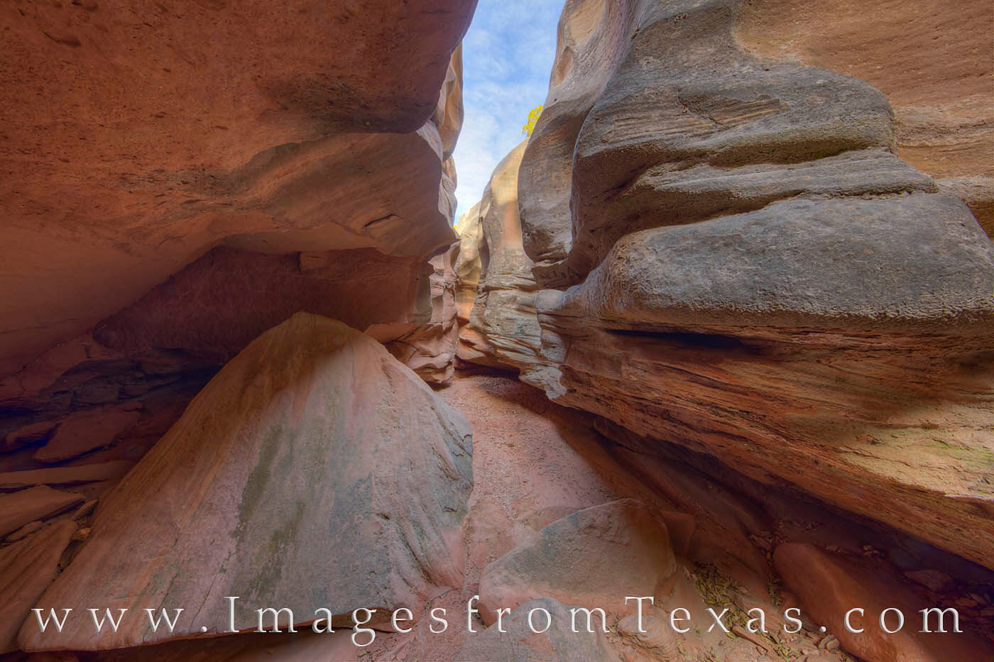This slot canyon in the lower portion of Central Utah Canyon radiates indirect orange sunlight on a cool November morning. The...