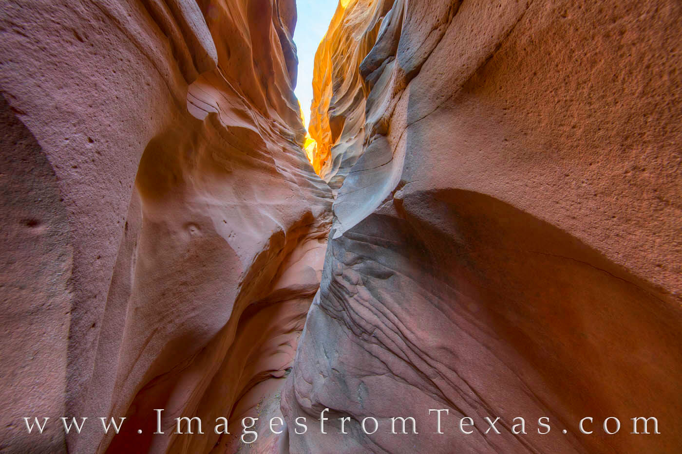 Sunlight peeks though the upper portions of Central Utah Canyon, a hidden slot canyon in a remote area of Palo Duro Canyon. Cut...