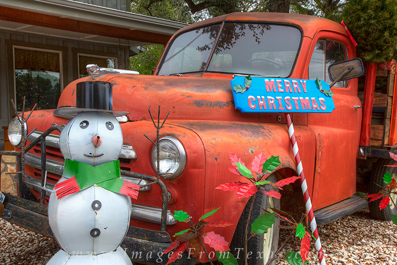 Along the main drag in Wimberley, a quaint little town in the Texas Hill Country, a snowman offers Christmas wishes to passersby...