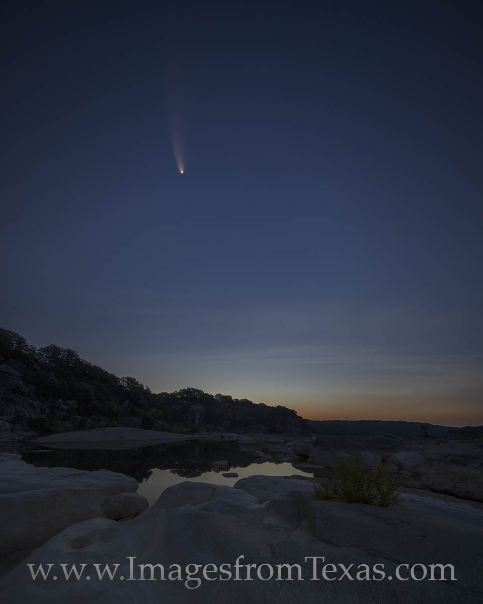Comet NEOWISE hangs in the early morning air over the Texas Hill Country. This pre-dawn photograph is a composite of two images...