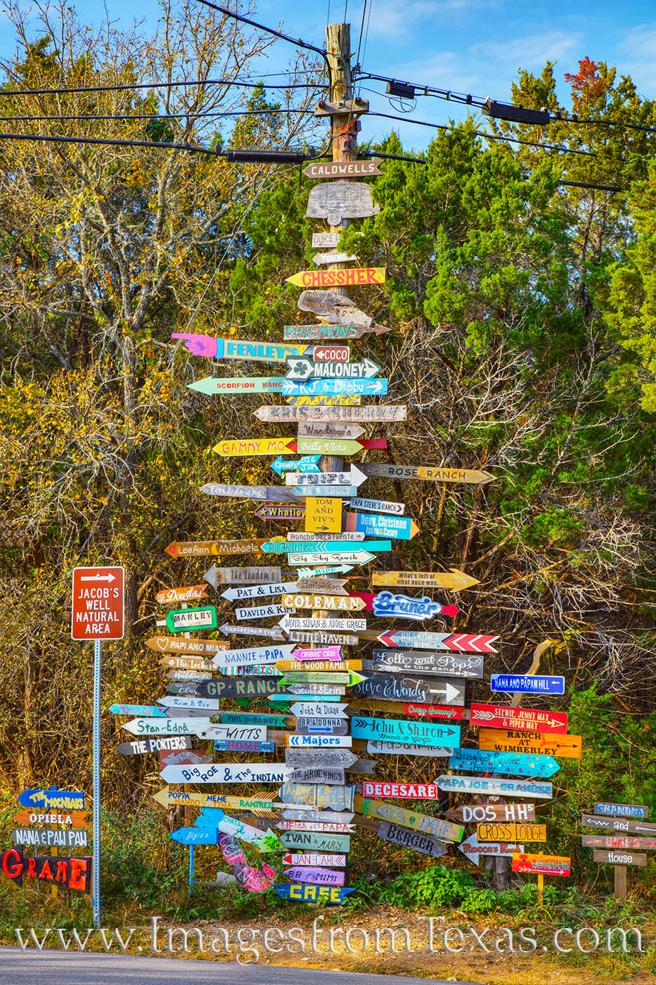 Along Jacob's Well Road near Wimberley, a collection of signs points in all dfferent directions. Find your destination and head...