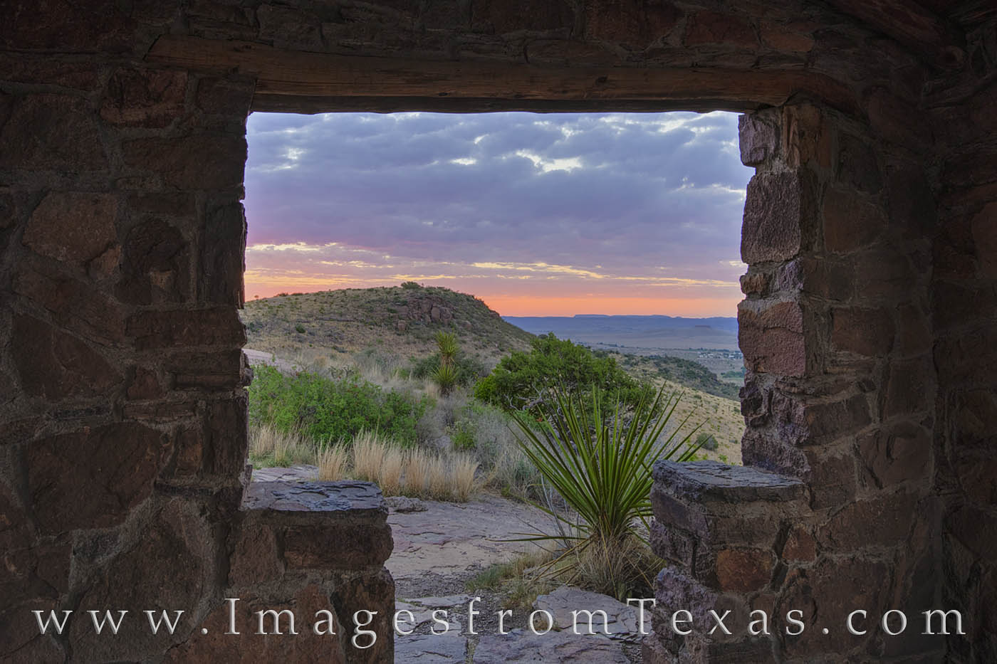 From inside a stone shelter along the CCC Trail in the Davis Mountains, this morning view looks out at the rugged landscape just...