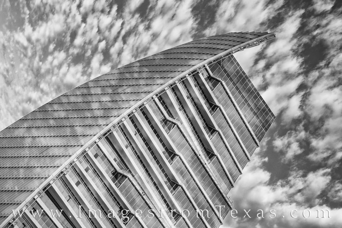 The Google building in downtown Austin, Texas, merges into a partly cloudy sky on a cool morning in this black and white image...