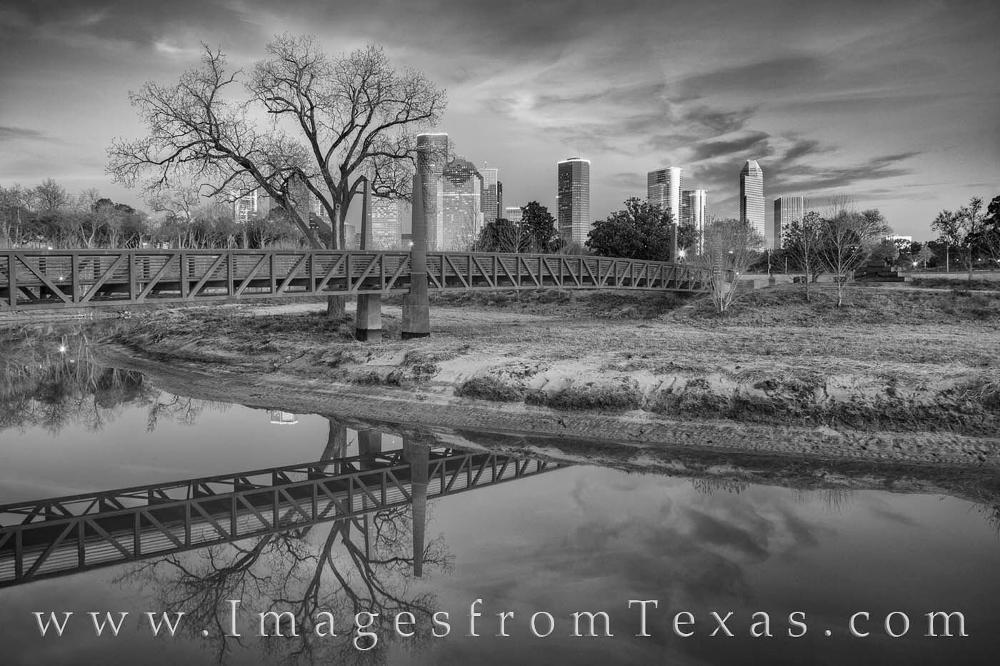 This black and white photograph from Eleanor Tinsley Park near downtow Houston shows a beautiful and cold night along the shores...