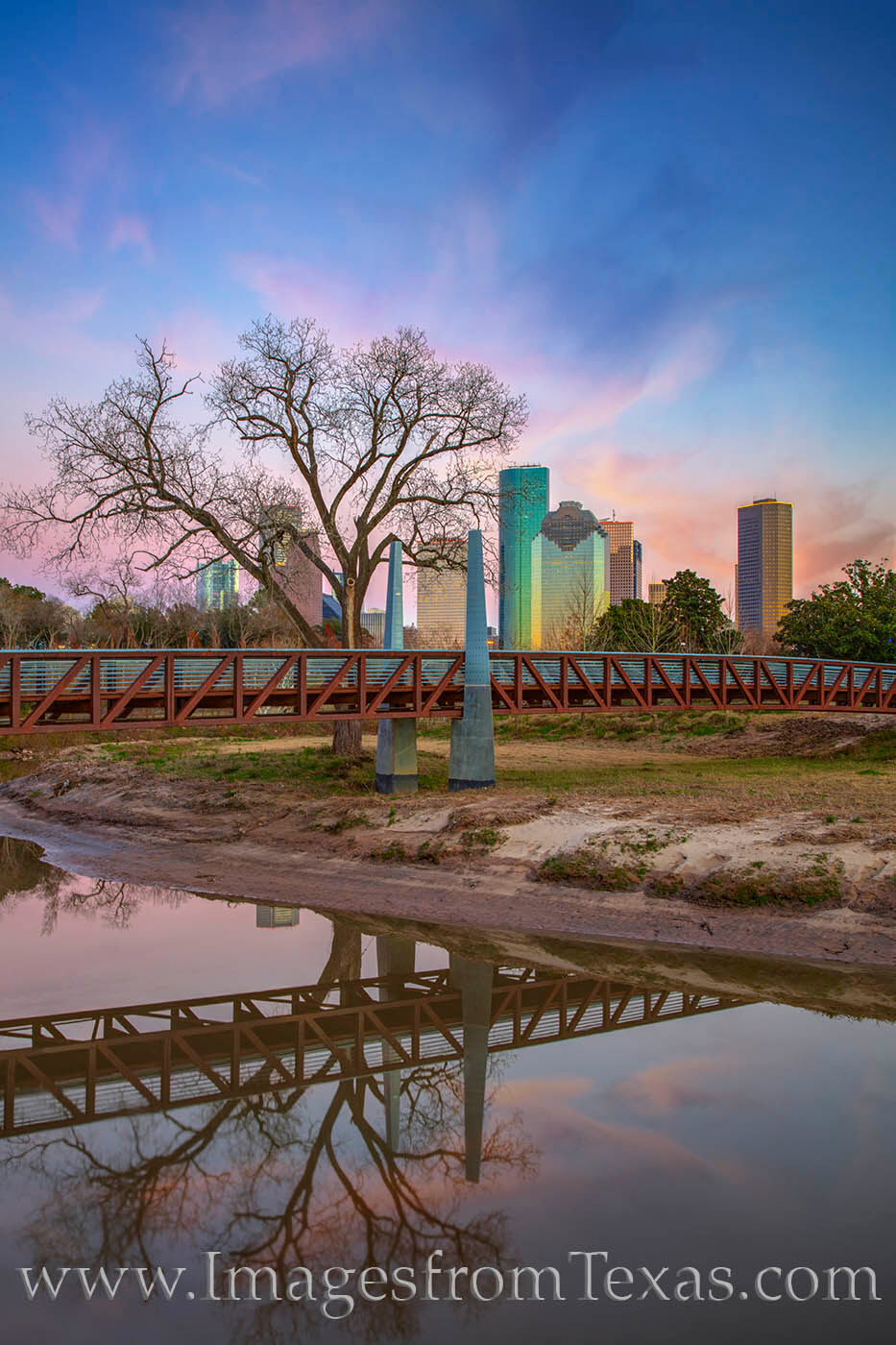 Carruth Pedestrian Bridge spans Buffalo Bayou on a cold Winter’s sunset. The sky’s pastel colors faded quickly as evening...