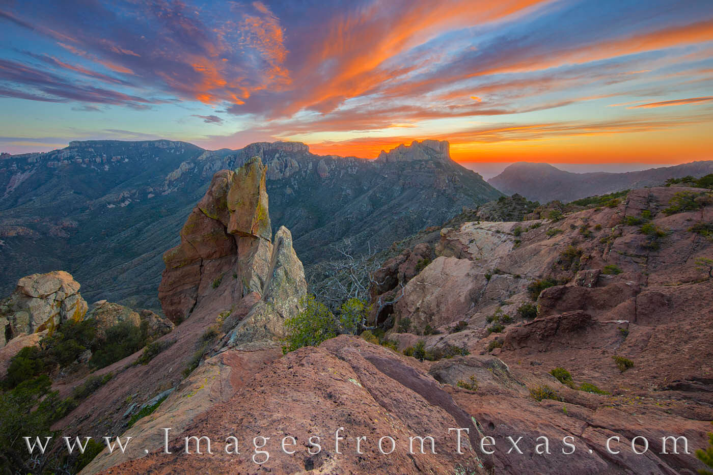 The last light falls across Big Bend National Park and Casa Grande. Seen here from the top of the Lost Mine Trail, an easy 5-...