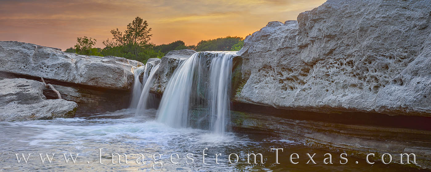 Another orange sky over the Lower Falls at McKinney Falls State Park brings a beautiful end to the day. Taken on a humid summer...