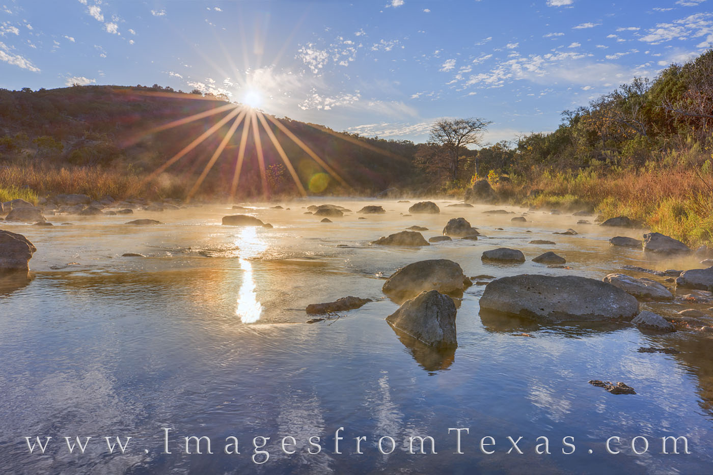 Shooting straight into the sun, this image shows the moments after sunrise looking downstream on the Pedernales River. It was...