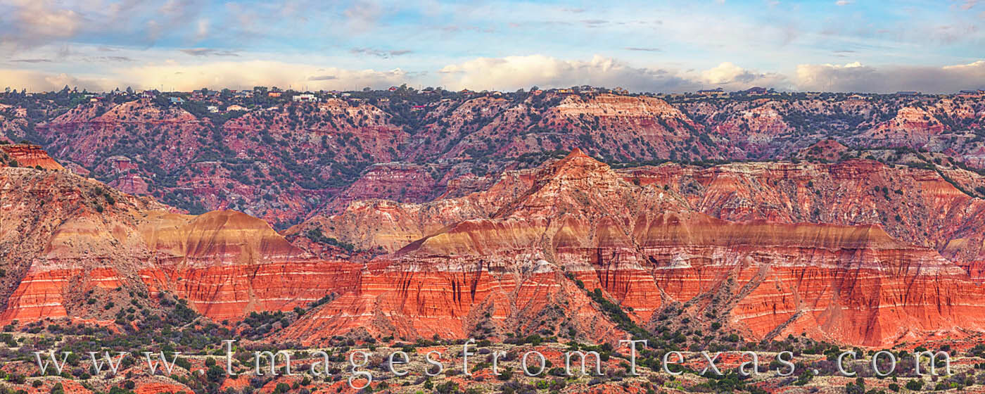 From the eye of a telephoto lens, this panorama shows the colors and texture of Palo Duro Canyon on a warm May morning. High...