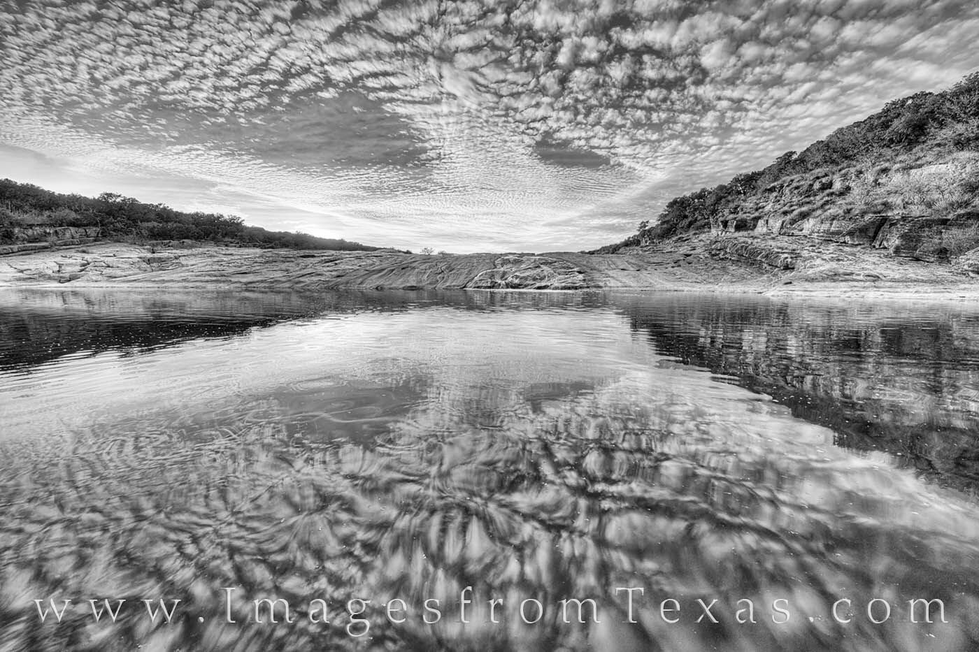 A pool in the cascades along the Pedernales River shows an amazing reflection of the evening sky. I liked the color version...