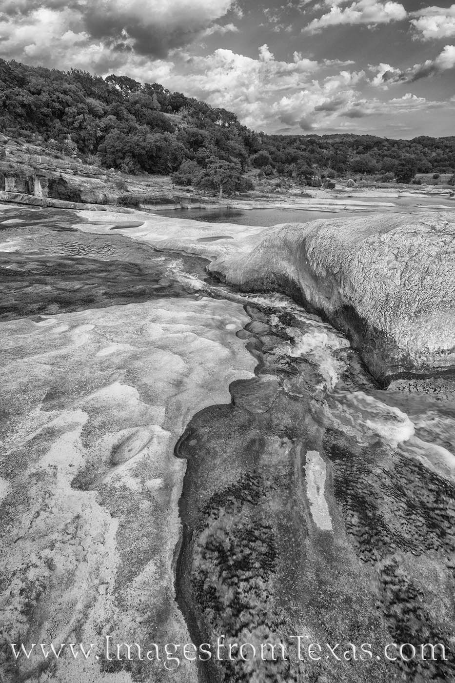 A contrast of limestone and water, black and white, is evident in this afternoon photograph from Padernales Falls State Park....