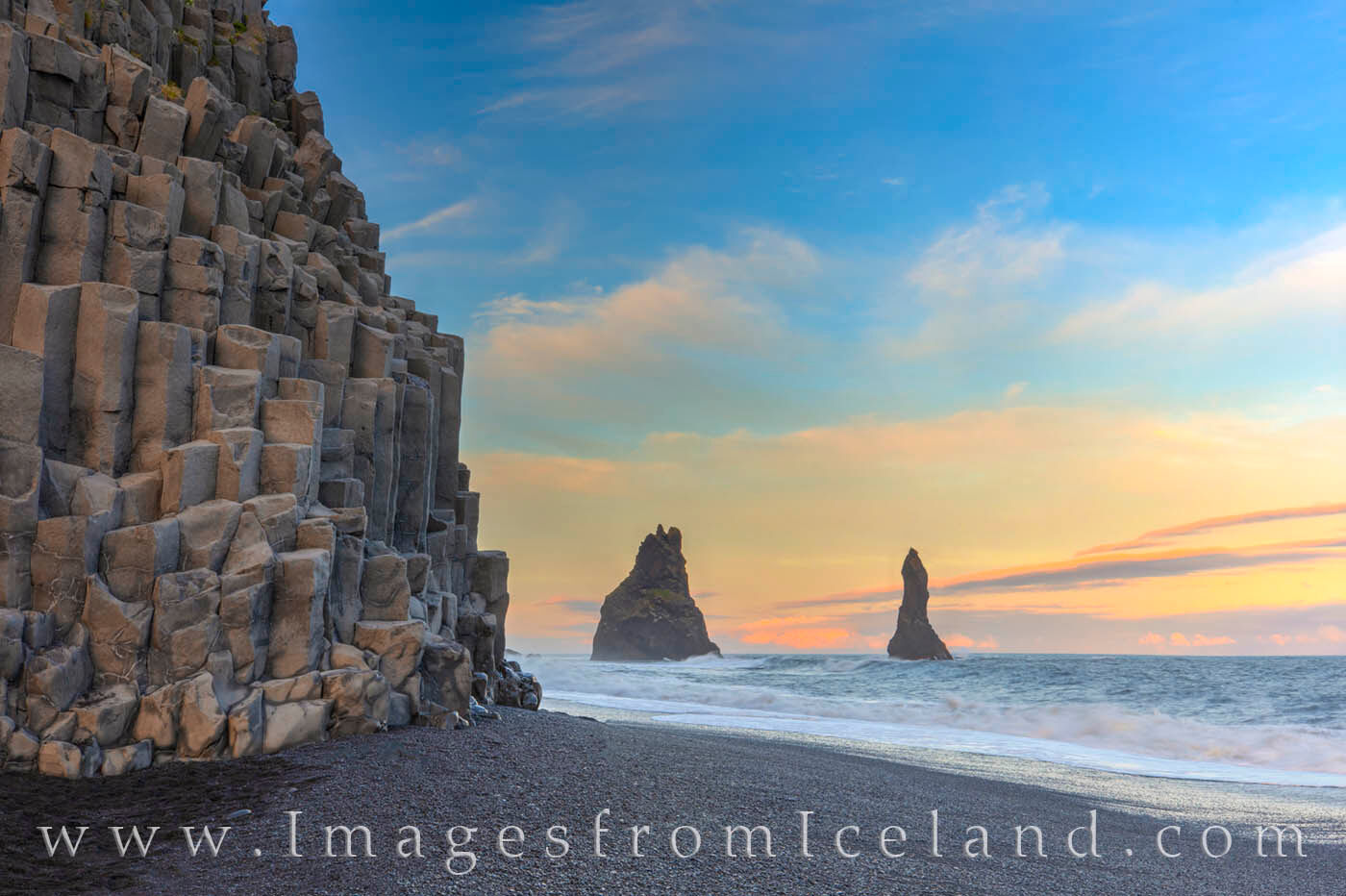 Beneath the soft light of the midnight sun, the skies above Reynisfjara Beach in south Iceland were colorful and calm. Along...