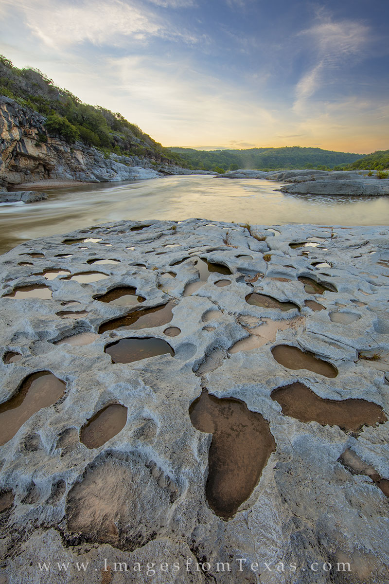 After heavy rains, small rock pools form in the limestone along the Pedernales River. This Hill Country photograph, taken at...