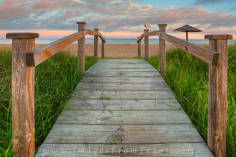 Several small bridges connect the grassy area of Rockport Beach to the actual beach itself. This view shows the steps leading...