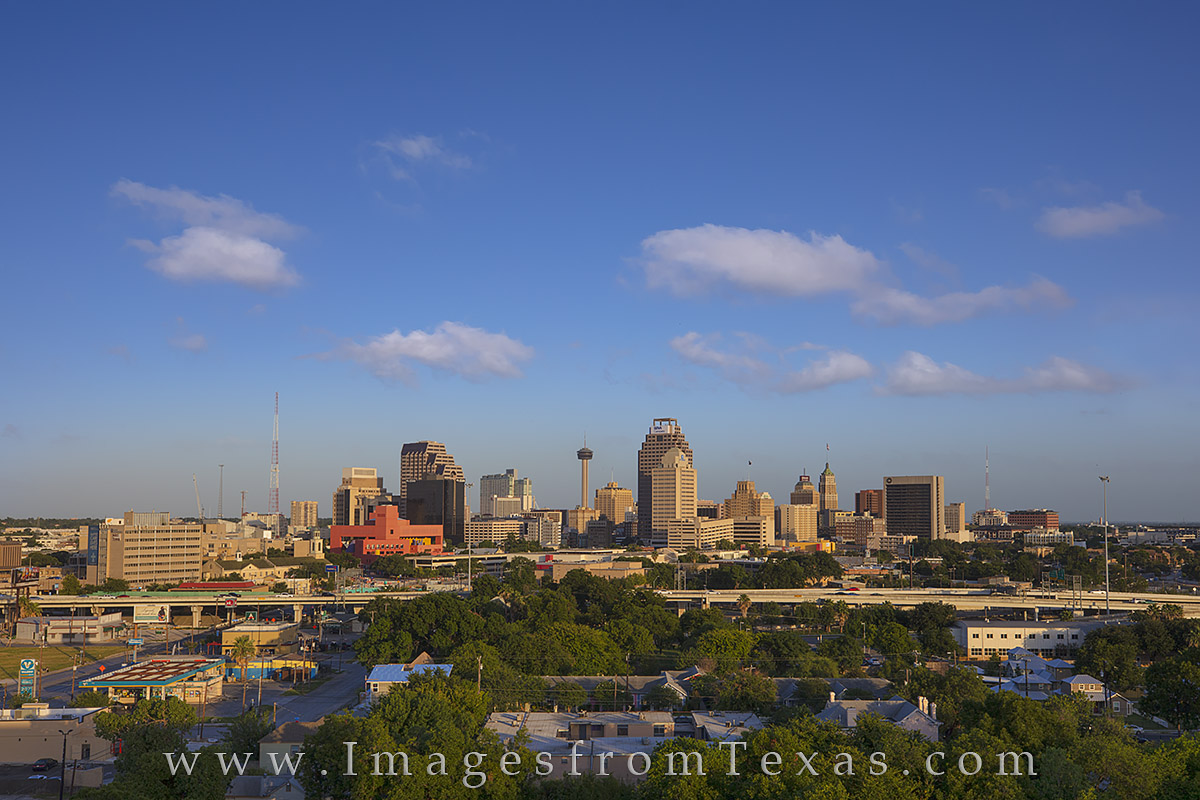 On a late summer afternoon, soft clouds float across the downtown skyline of San Antonio, Texas. The most recognizable highrise...