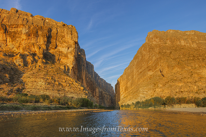 The first light of a spring morning bathes the 1,500 feet high walls of Big Bend's Santa Elena Canyon in a warm glow. The Rio...