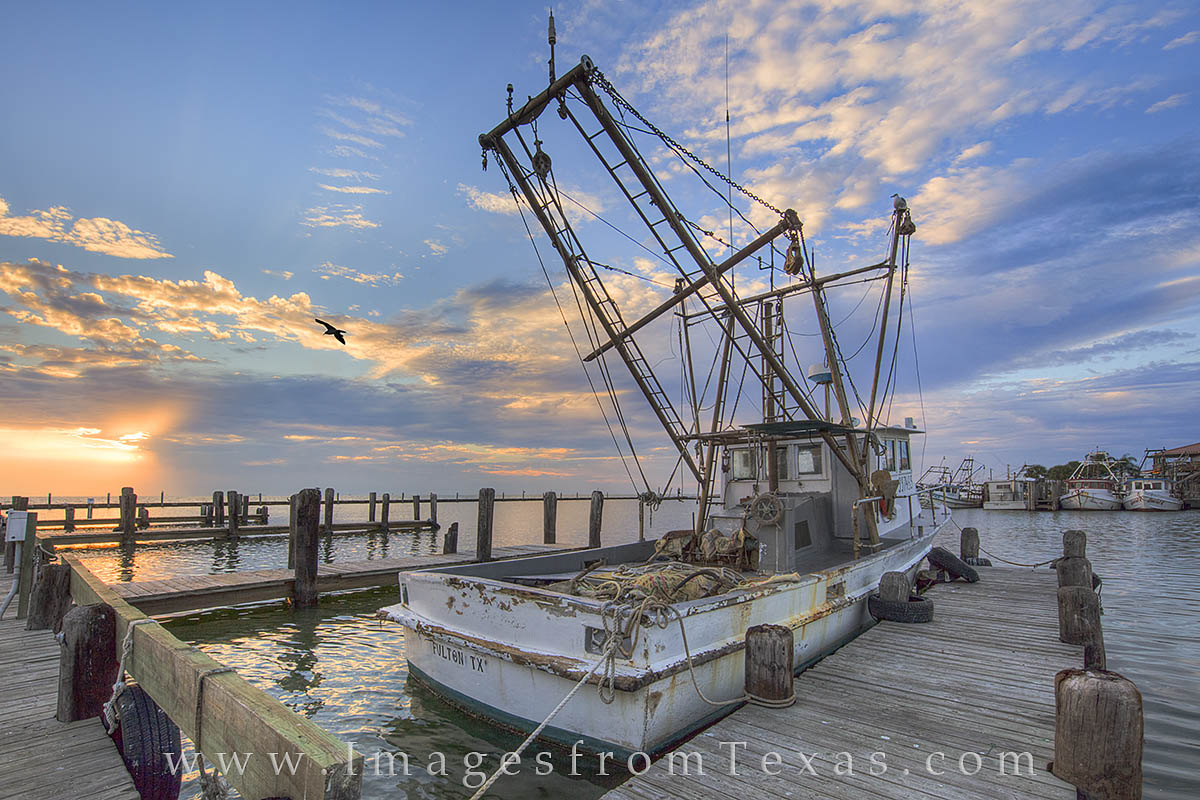 I stopped to photograph this old shrimp boat in the Rockport-Fulton harbor because, to me, it had character. I imagined the tales...