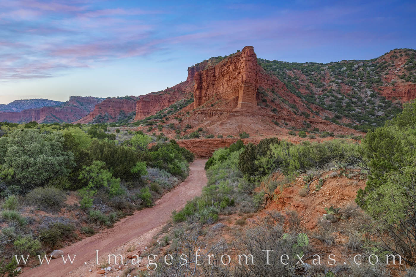 Clouds change from white to pink to darker hues over Caprock Canyons State Park on a cool October evening. This view comes from...