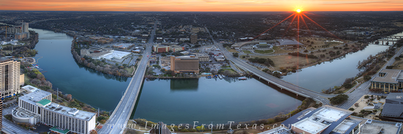 From high above downtown Austin, Texas, this panorama shows the landscape view looking southwest across Lady Bird Lake. The sun...