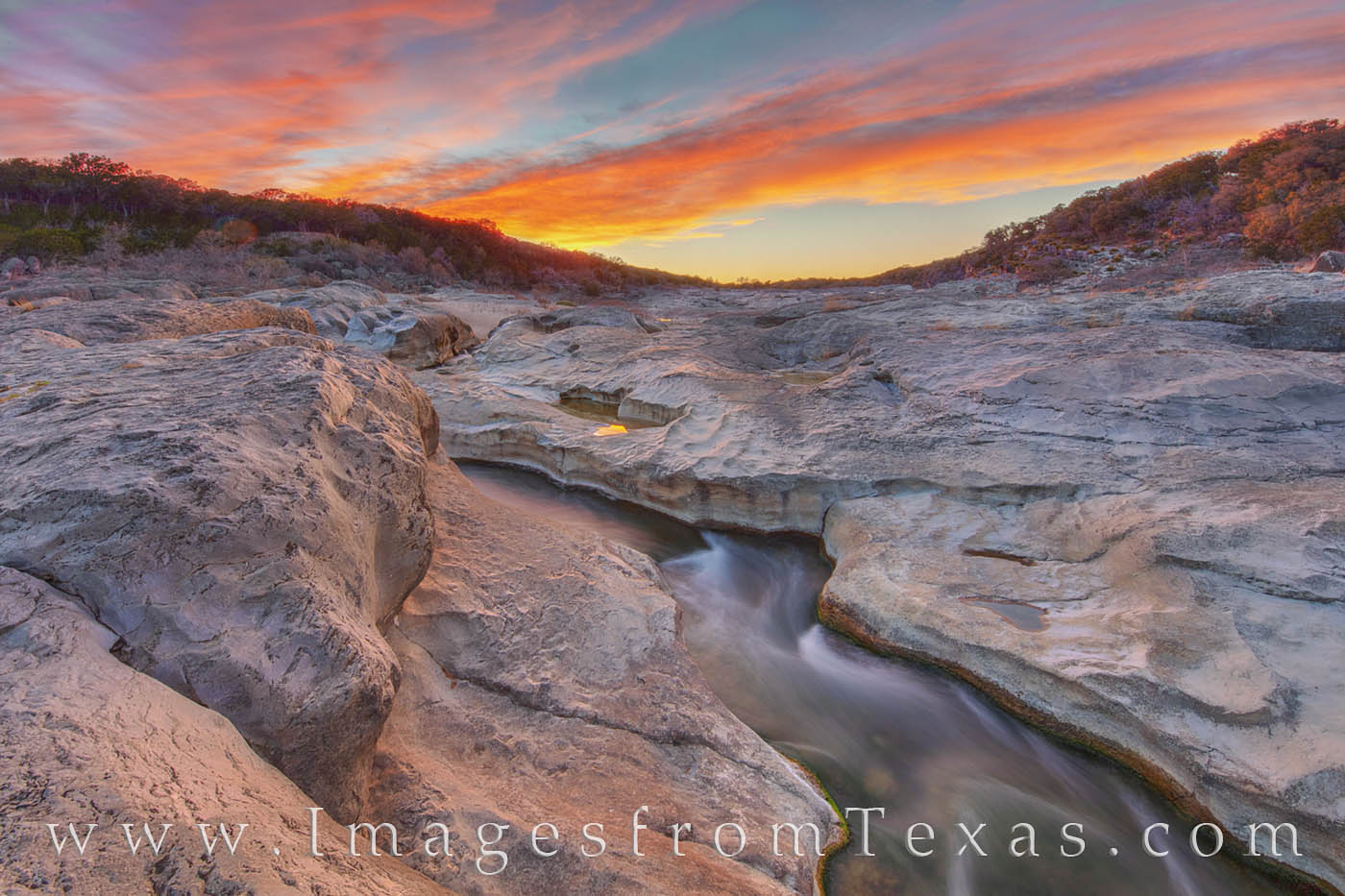 A beautiful sunset brings a spectacular ending to a fun evening at Pedernales Falls State Park. The river runs cool and clean...