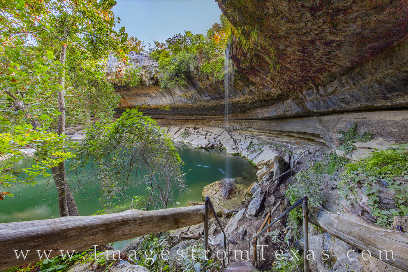 Stairs lead down to the grotto of Hamilton Pool, a grotto just west of Austin, Texas.
