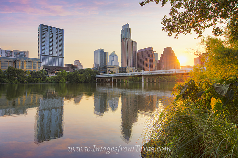 From the banks of Lady Bird Lake and the Zilker Park Hike and Bike Trail, this image shows the Austin skyline just after sunrise...