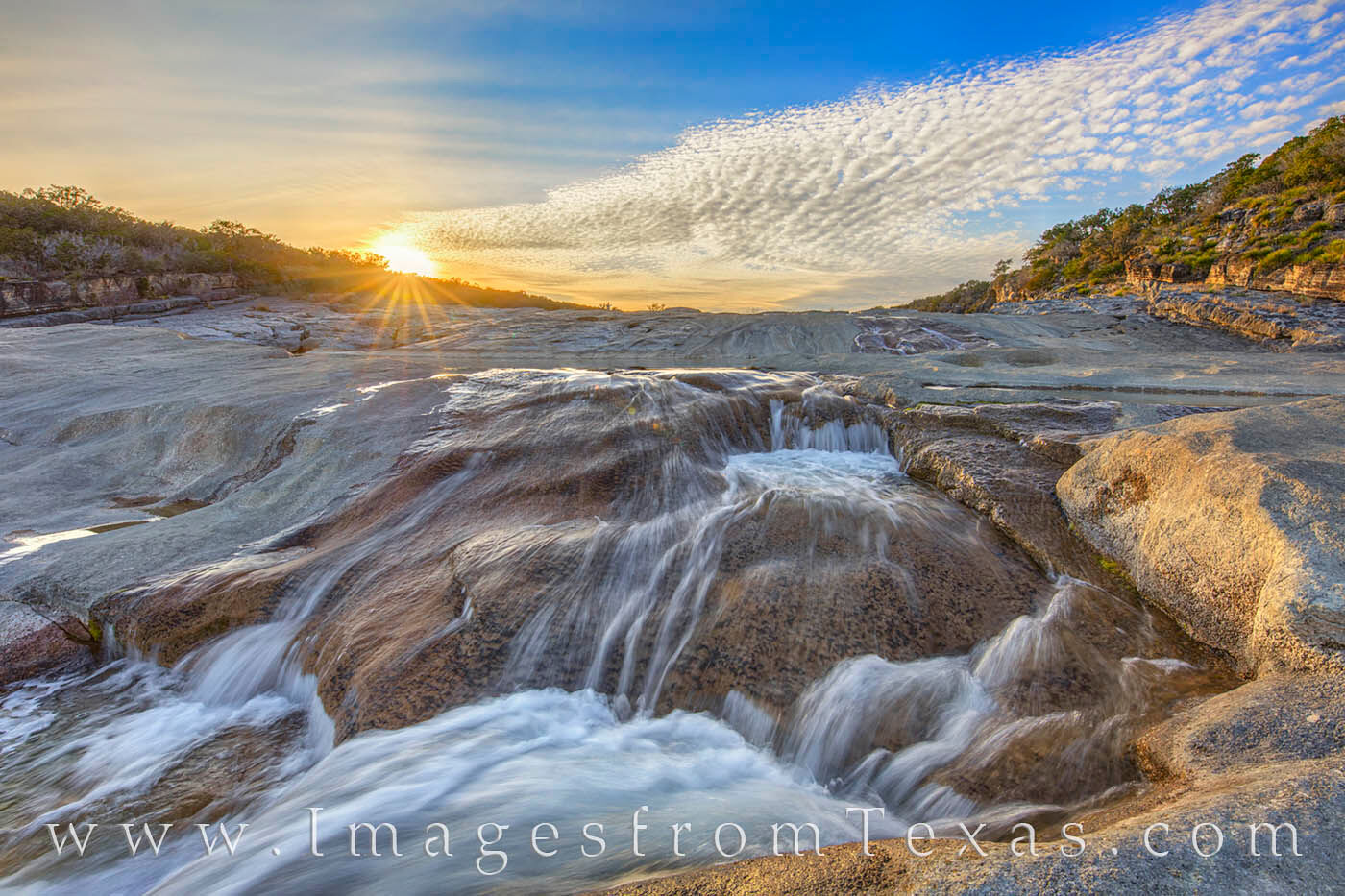 Sunset at Pedernales Falls was beautiful on this evening. Cold, clear water rushed over the limestone rocks, the rays of the...