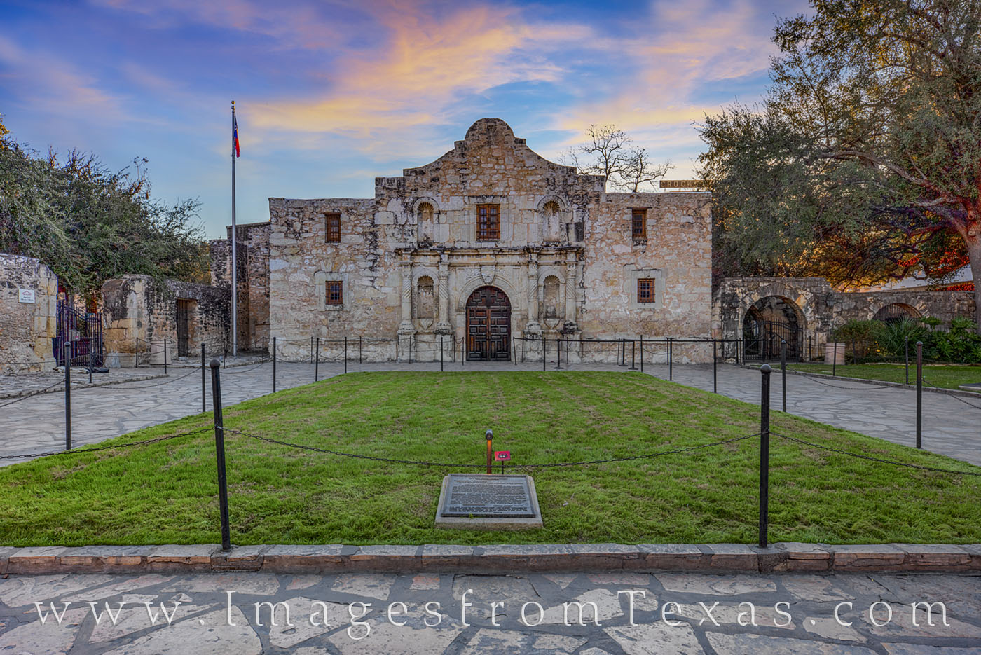 On a cold December morning, the pre-dawn skies light up in pastel pink and blue over the Alamo in San Antonio, Texas. Not far...
