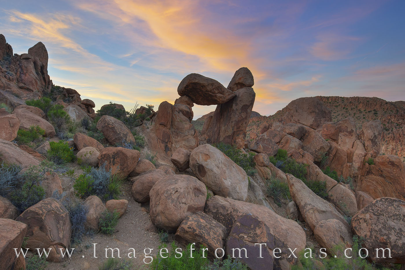 Looking northwest from at Balanced Rock in Big Bend National Park, the evening sky begins to turn pastel shades of pink and blue...