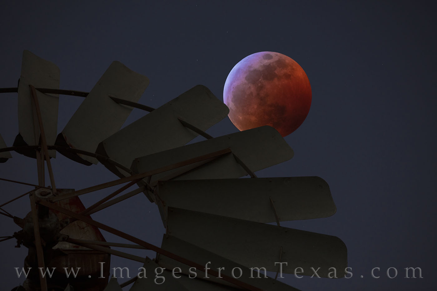 On a cold January night, the rare Super Blood Wolf Moon hangs in the dark sky over the Texas Hill Country. At its closest point...
