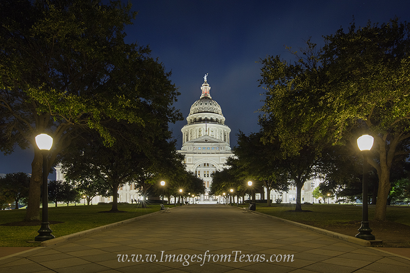 Lights illuminate the Great Walk in the front of the Texas Capitol building in Austin, Texas. Comprised of granite, the historic...