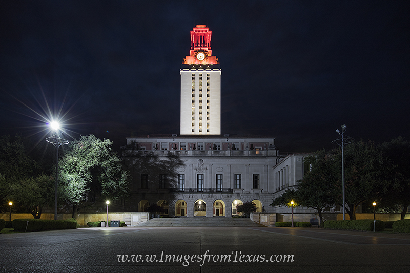 Early in the morning, the UT Tower glows orange after a win in football the evening before. This image from the Texas campus...