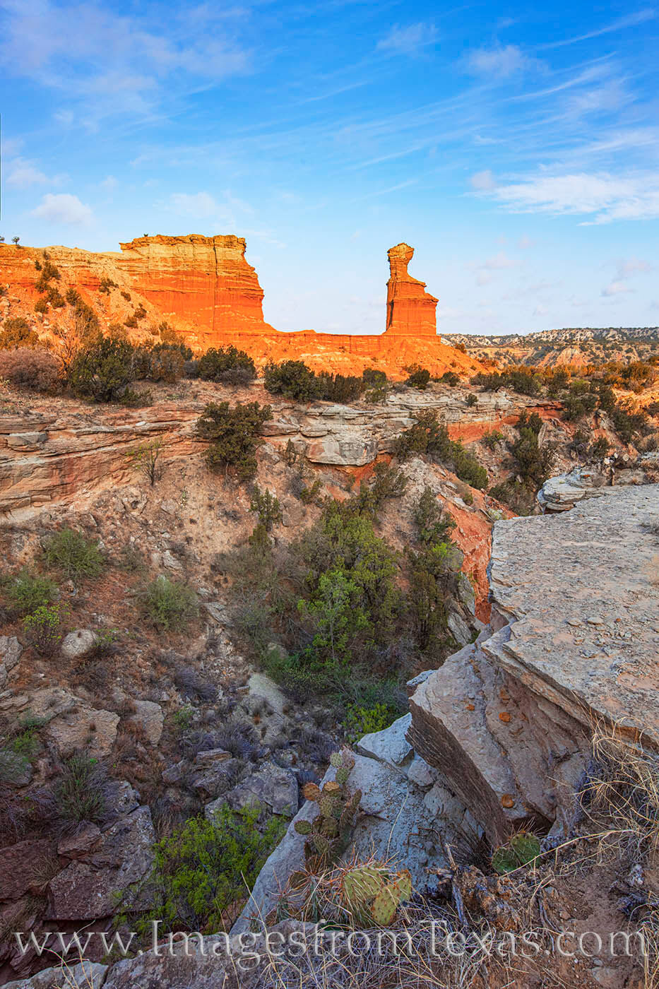 From the opposite side of a small canyon, this view looks across the valley to the iconic Lighthouse hoodoo in Palo Duro Canyon...
