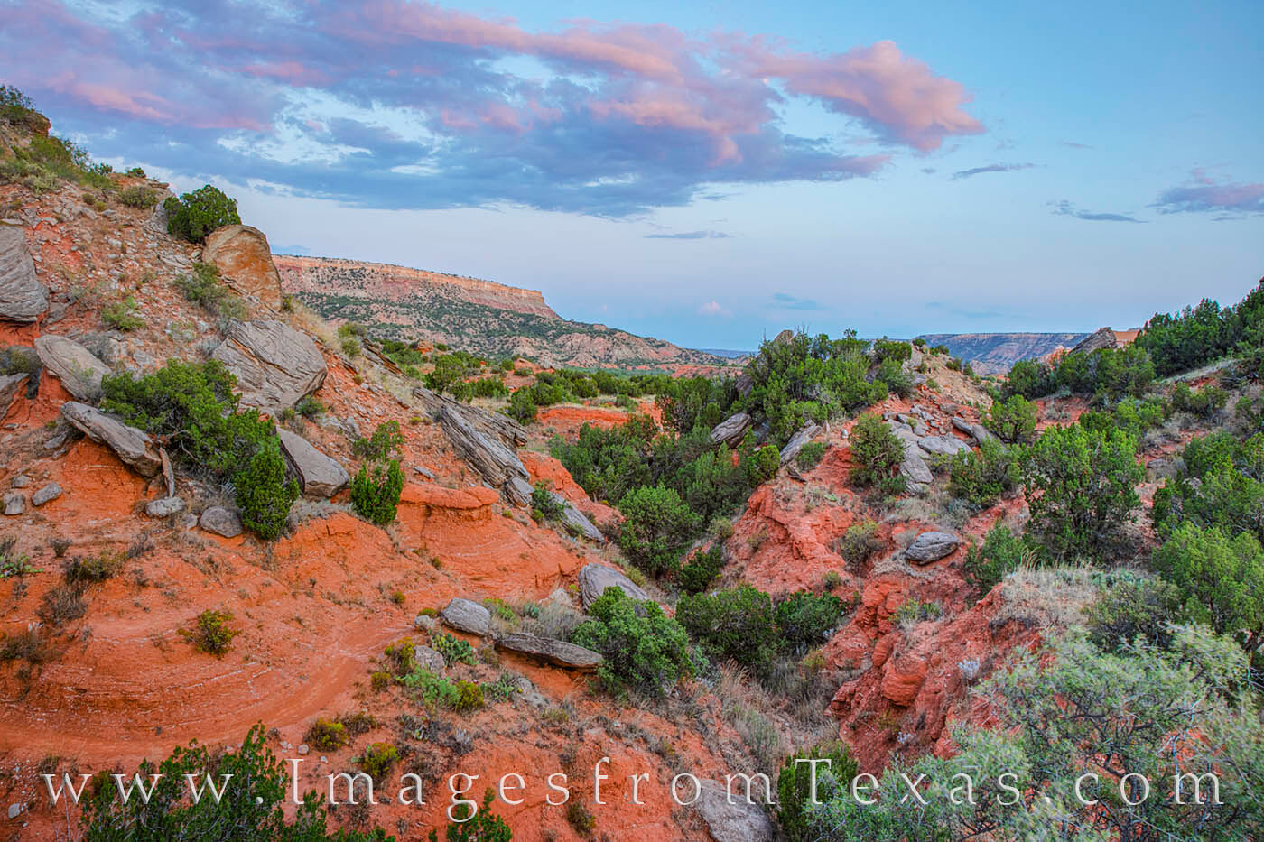 This view comes from the GSL Trail just after sunset. Looking southeast, the landscape is rugged as the trail winds around small...