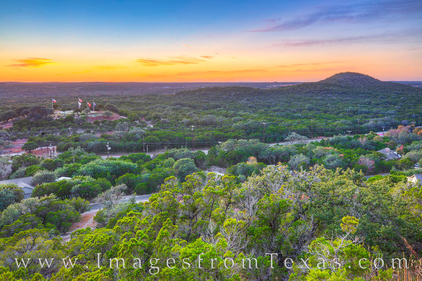 The sky turns beautiful shades of orange and blue just after sunset on a November evening. This view comes from Old Baldy, a...